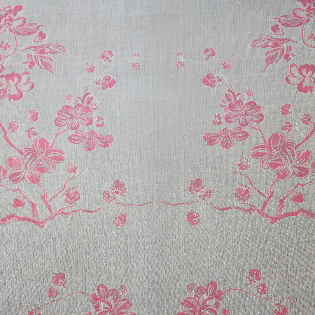 Pink floral pattern on a light gray background