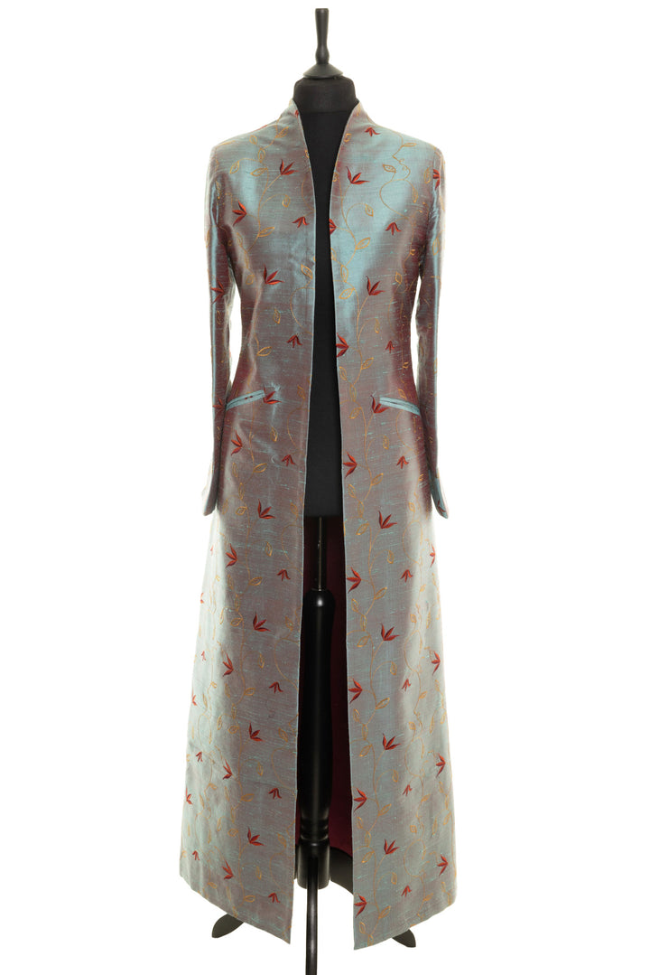High-end silk opera coat with exquisite embroidery for upscale events. This women's maxi coat in in smokey blue colour with red and yellow delicate embroidery.