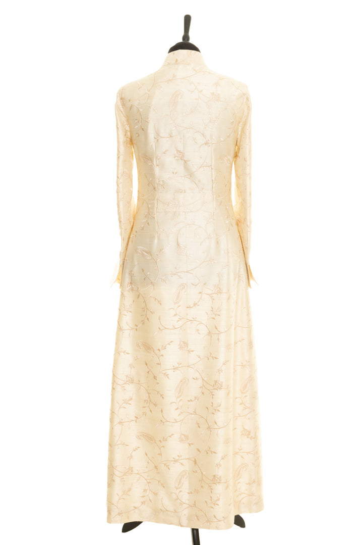 Beautiful long silk ivory coat, perfect for brides. Long fitted beige coat with same colour embroidery.