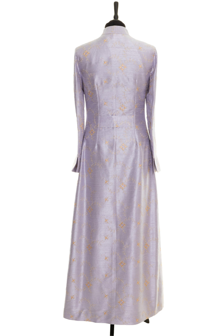 Elegant embroidered long silk coat, ideal for wedding guests and formal occasions. Lilac coat with golden embroidered floral pattern.