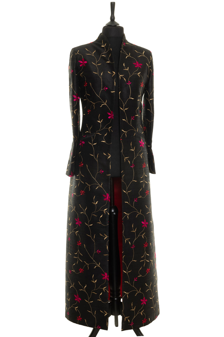 Sophisticated embroidered silk opera coat for special events. This coat in full length made from black silk fabric with golden and pink floral embroidery.