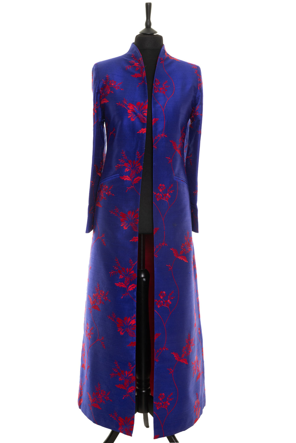 Elegant full lengths coat in blue with red floral pattern.