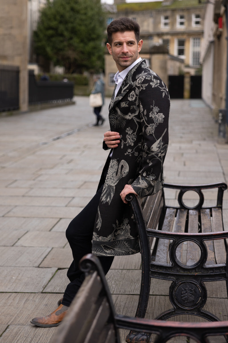 smart long men's coat in black with flowers and birds pattern