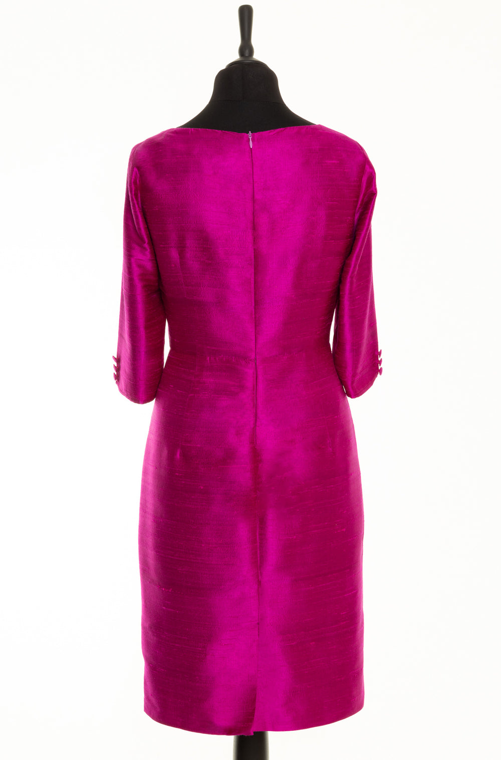 Silk shift knee length pink dress for mature ladies. It has longer sleeves with three buttons and it is a fitted dress.