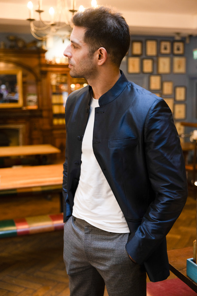man in the bar wearing a slate silk nehru jacket