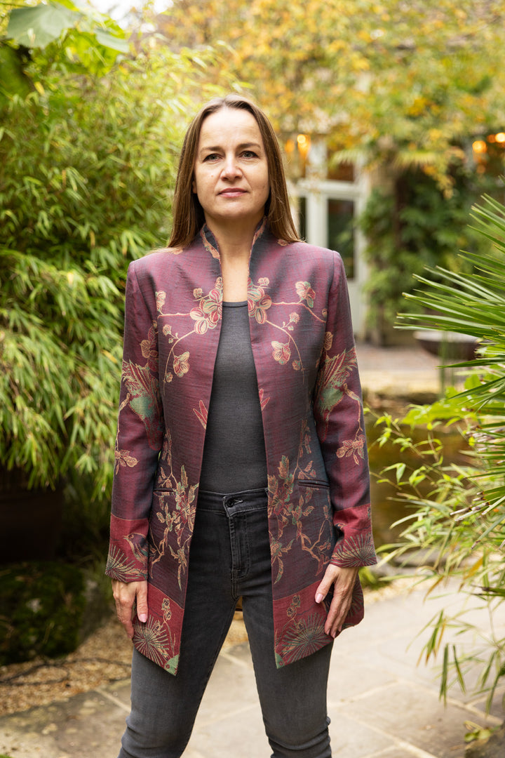 Purple cashmere jacket for women. This women's jacket has flowers and birds motif. It is an open jacket worn with jeans and t-shirt. Smart and casual jacket.