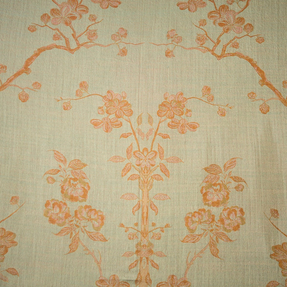 Fabric with floral and bird pattern in orange on a beige background