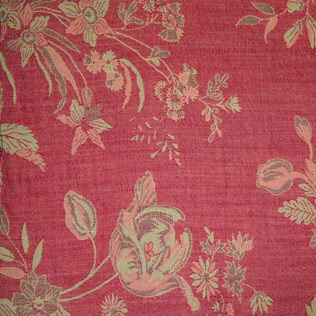 Floral green patterned fabric with deep pink background