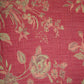 Floral green patterned fabric with deep pink background