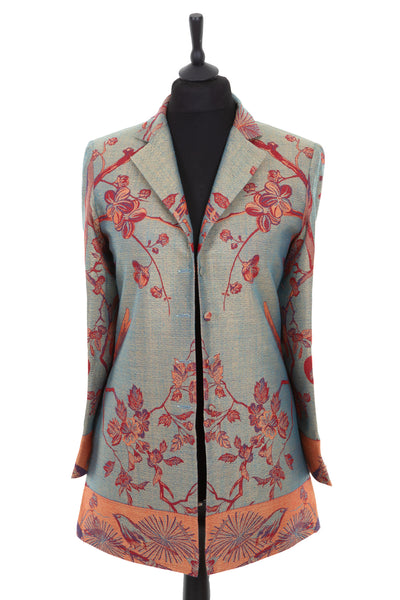 Womens longline blazer style jacket in a dark green cashmere fabric with the Tree of Life pattern in red, orange and blue