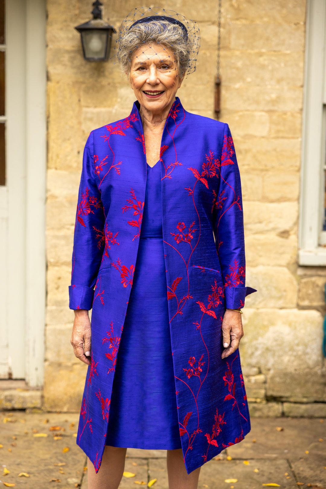 Shibumi French cobalt coat with raw cobalt dress. Mid length women's coat in bright blue with big red floral pattern.  With shift silk dress in blue.