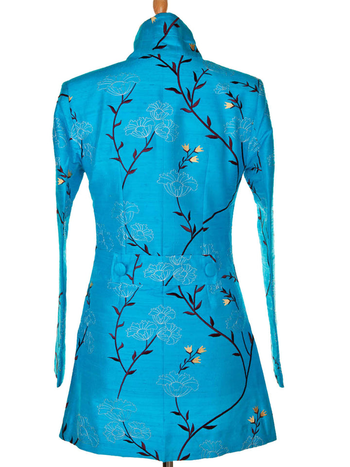 Back of a silk jacket with stunning flower pattern. Elegant wedding guest turquoise jacket. Mother of the groom outfit.