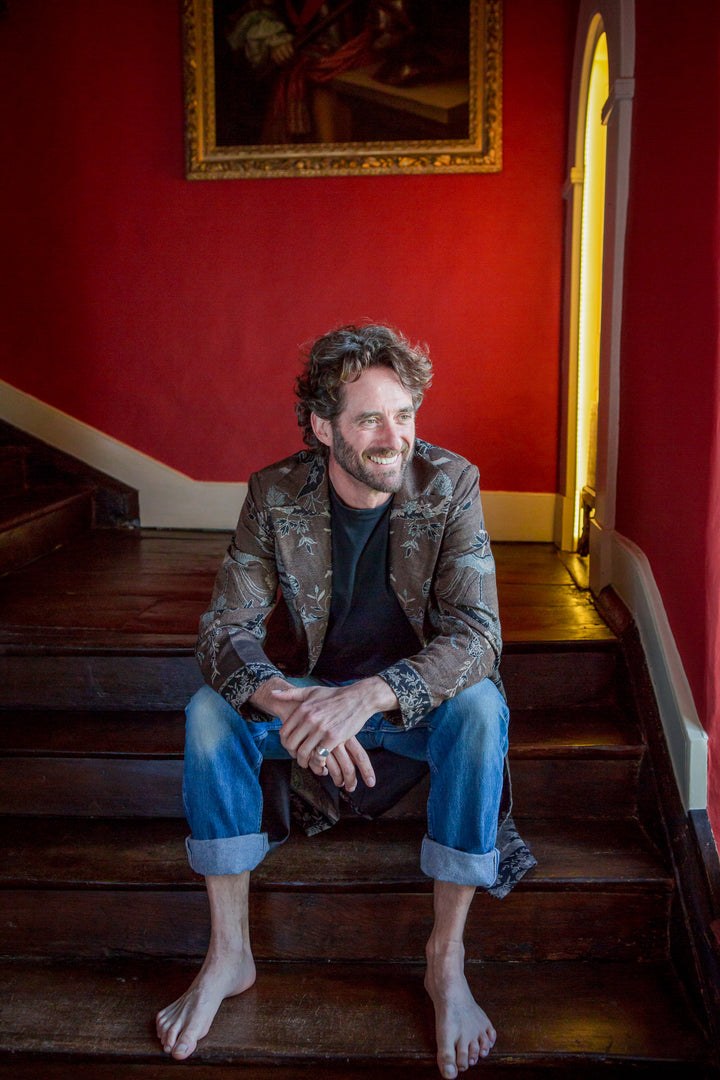 Best man outfit. Brown cashmere coat for men with floral pattern.