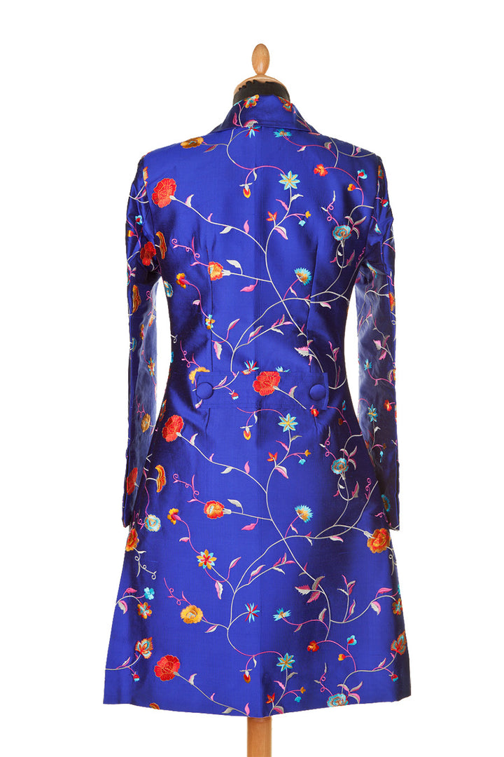 Short women's silk coat with floral pattern.
