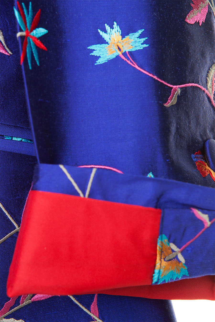 Sleeve of a silk blue women's coat. Mother of the groom dress coat.