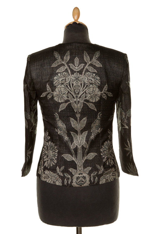 back of a short jacket in black with flowers and birds 
