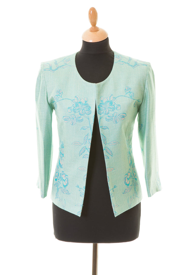 Chanel style, short cashmere jacket in light blue with pattern. 