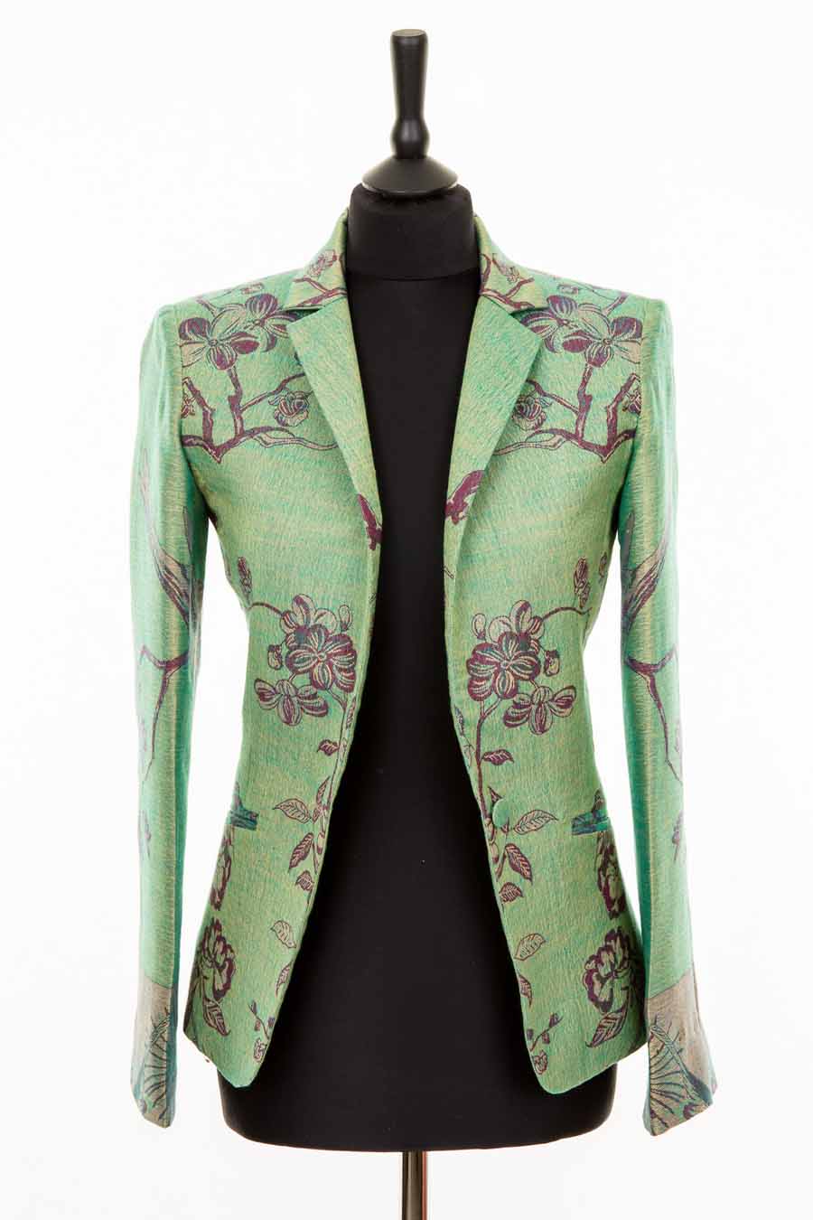 Cashmere fitted green jacket with red and purple flowers.