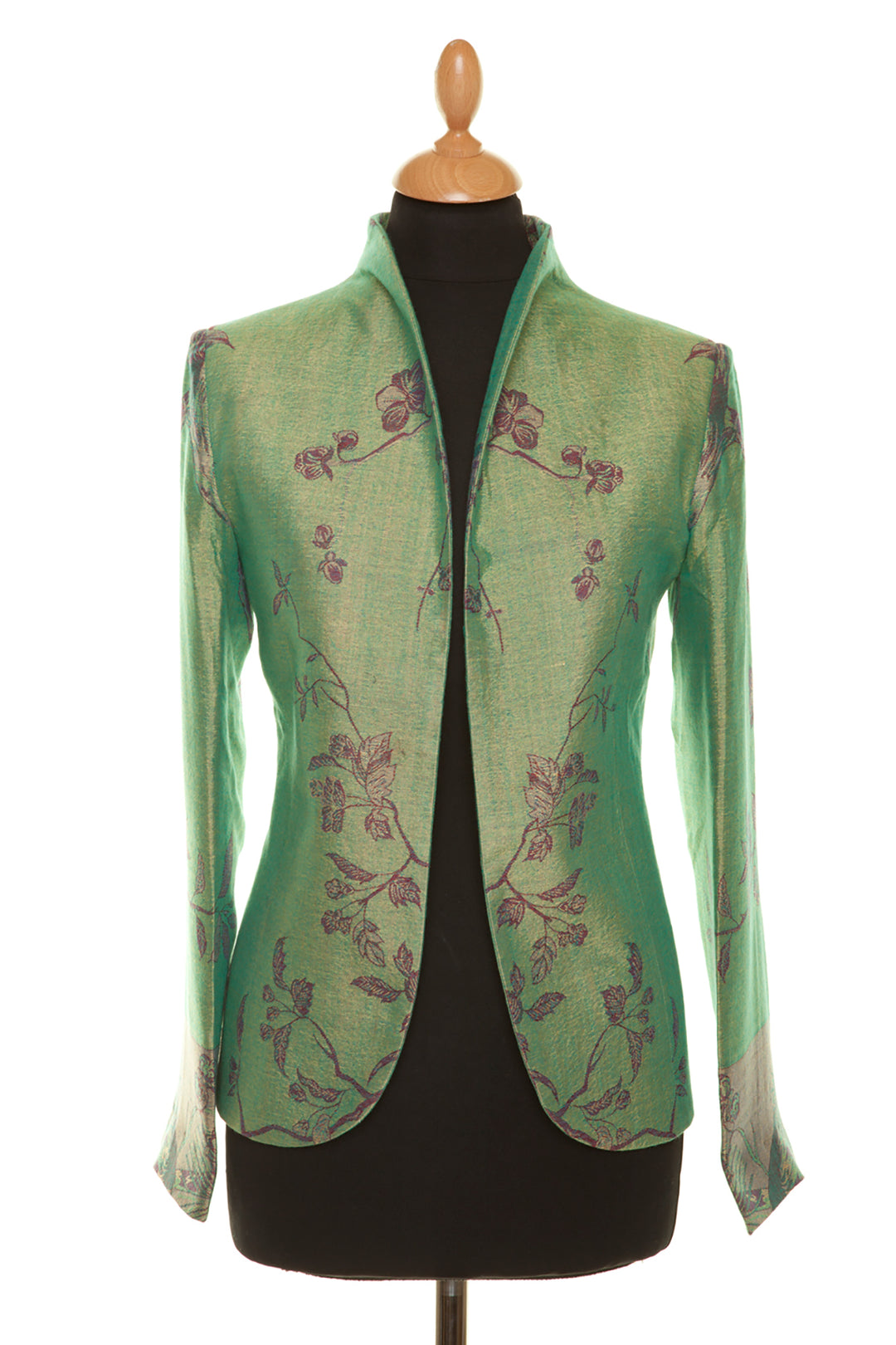 Smart short women's silk jacket in green with floral pattern.