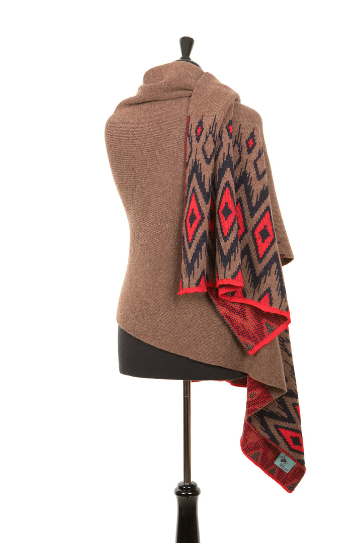 Brown shall with aztec pattern in red and black.