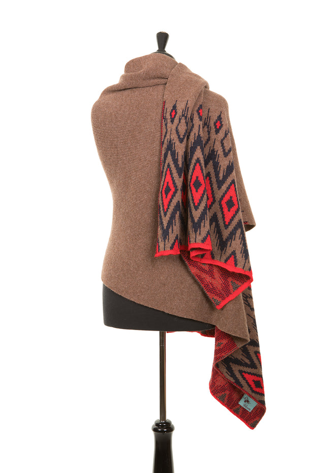Brown shall with aztec pattern in red and black. 