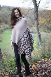 Lady wearing geometric pattern shawl. 