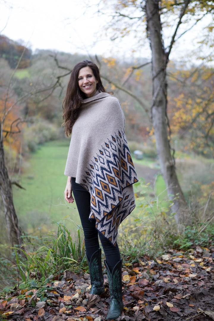 Alpaca shawl in beige with aztec pattern.