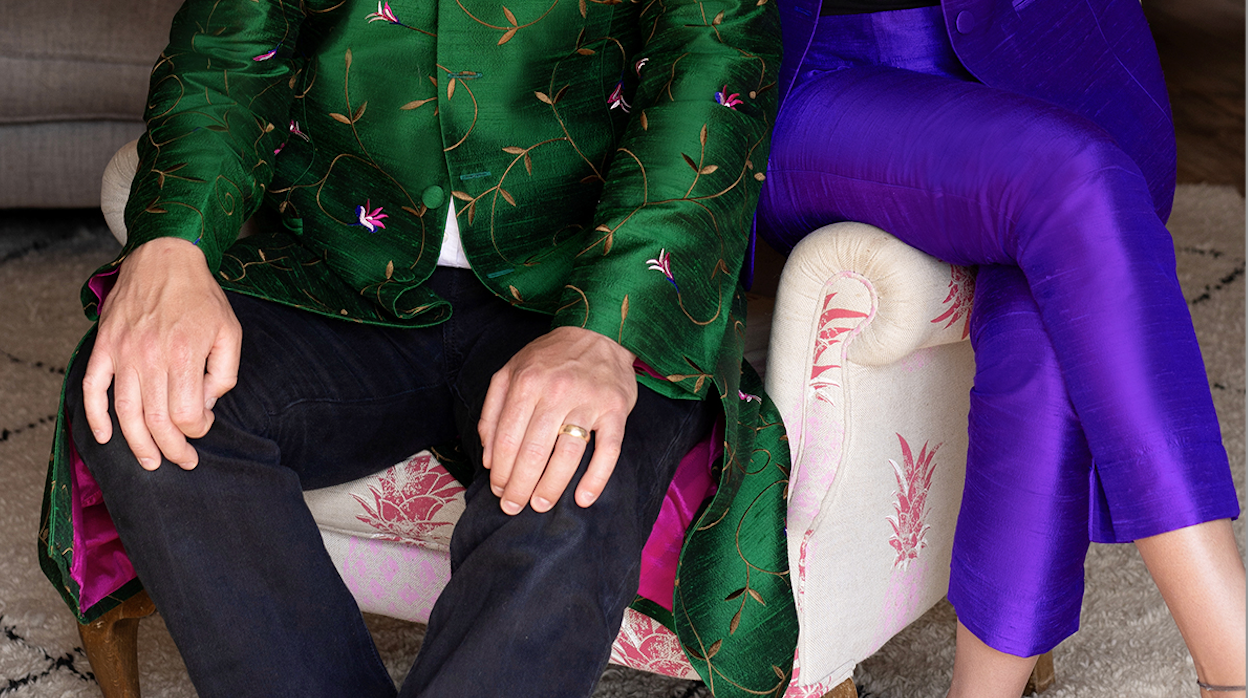 Woman wearing Shibumi Silk Cigarette Trousers in vibrant purple raw silk with a coordinating jacket for a wedding or special occasion.
