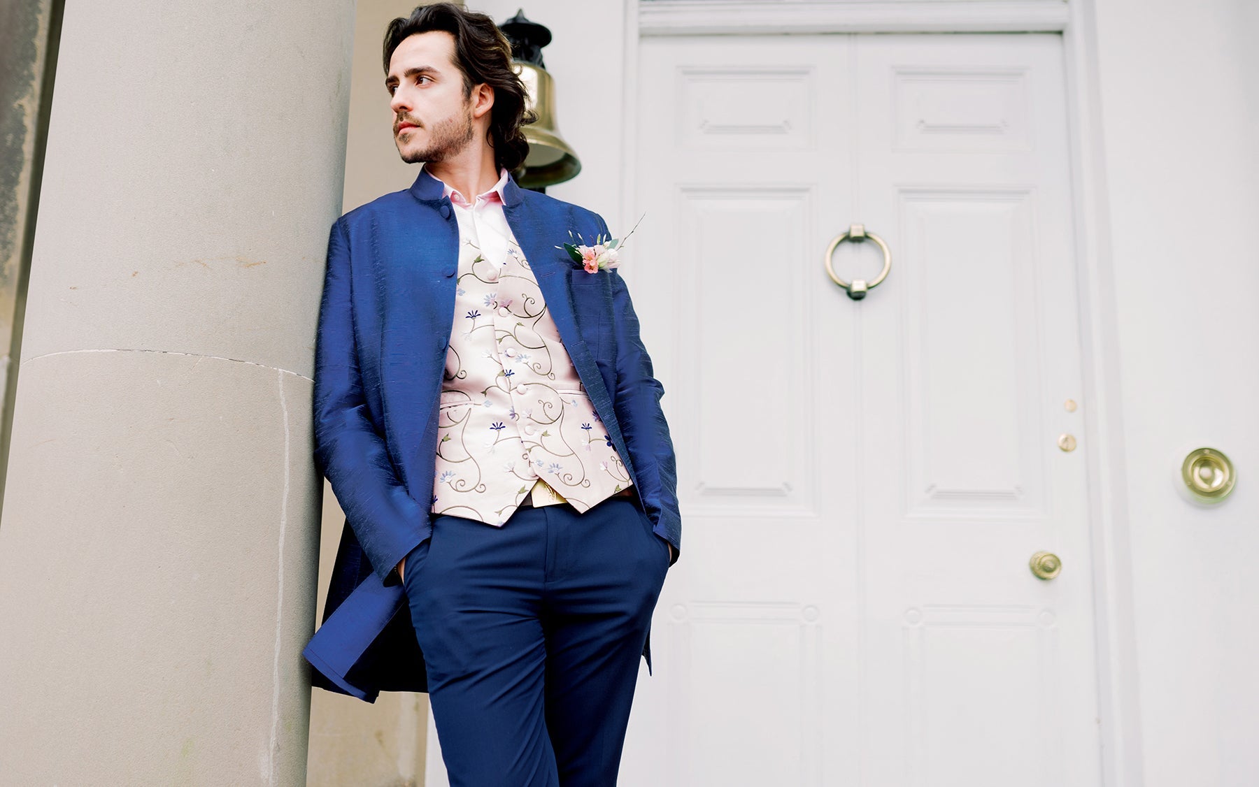 ￼￼￼Man wearing a Shibumi silk Nehru coat and embroidered waistcoat, styled for weddings, black tie events and formal occasion wear.