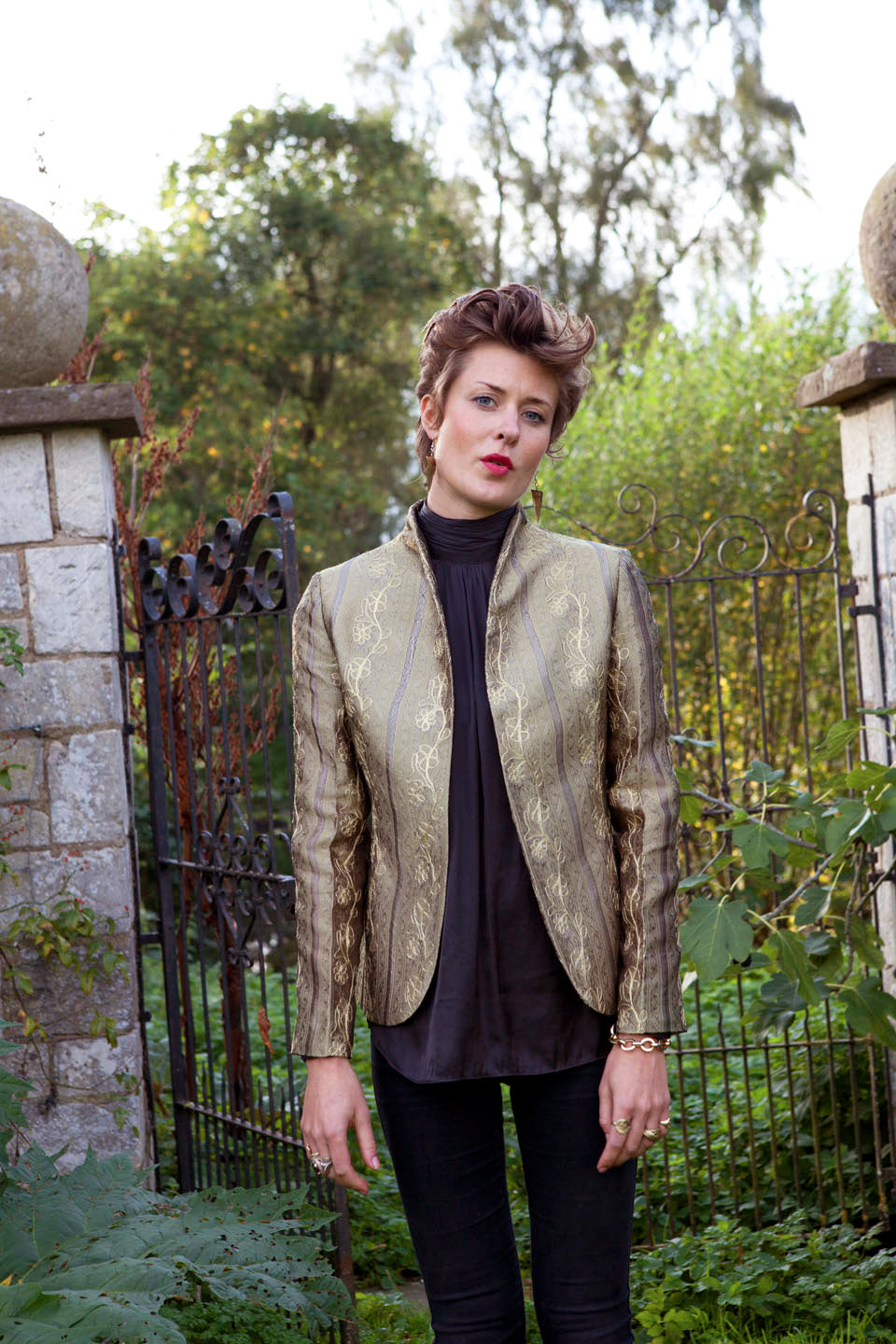 Gold embroidered silk jacket worn with jeans. 