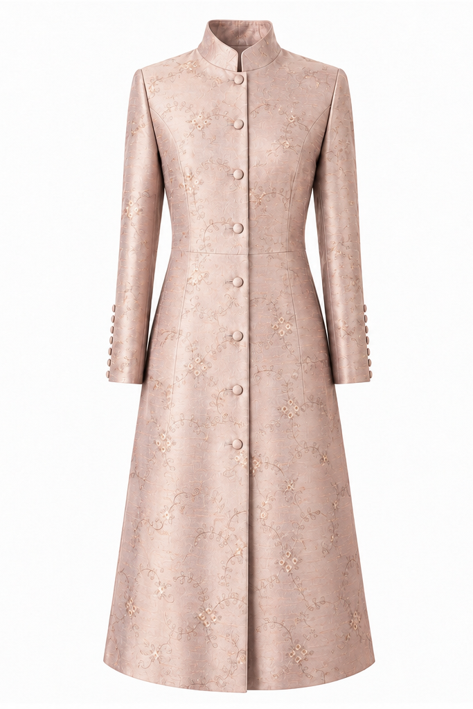 A long-sleeved, high-neck midi coat shown from both front and back views. The coat is a light blush pink with a subtle, tonal floral jacquard pattern and decorative buttons on the front and cuffs.