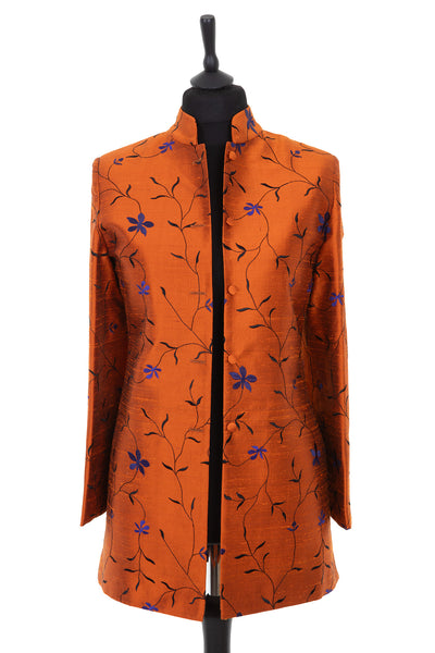 Womens longline nehru jacket in a burnt orange raw silk with beautiful violet floral embroidery