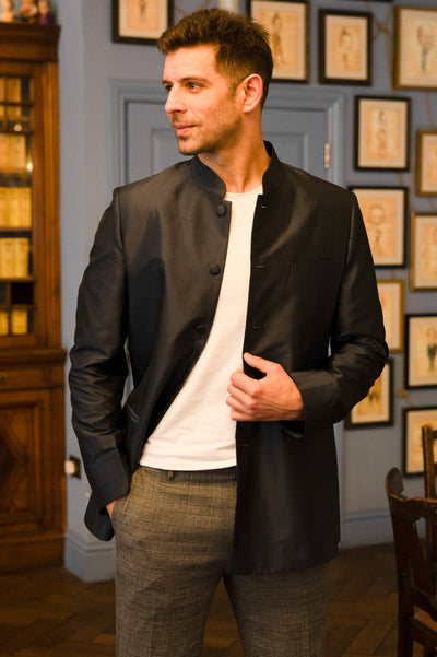man wearing a smart silk dark blue jacket