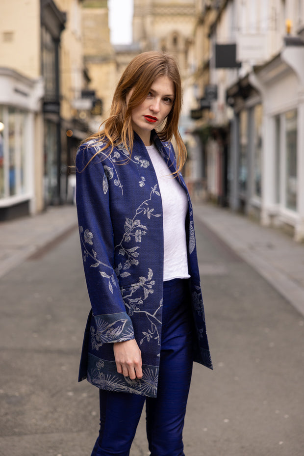 model wearing a blue smart cashmere jacket on the street, City of Bath 