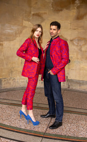 vibrant red clothes worn on man and a women in the City of Bath