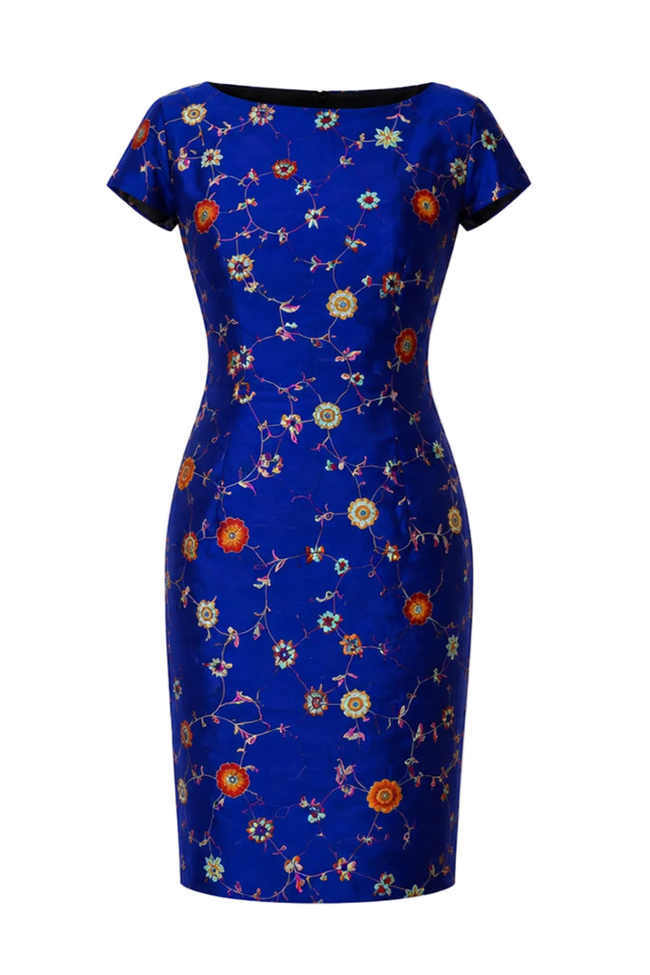 A royal blue short-sleeve sheath dress with a vibrant floral pattern in orange, yellow, and white, shown against a plain white background.