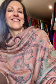 Brunette woman wearing reversible cashmere silk blend shawl in a warm Dusty Pink