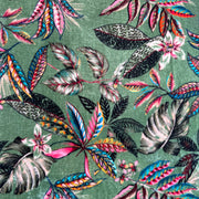 A sumptuous botanical green silk velvet printed with a rich floral design