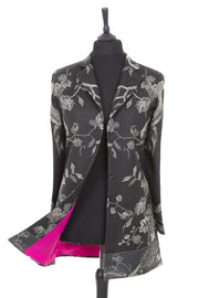 Womens cashmere longline blazer style jacket in a black cashmere fabric with a Tree of Life pattern in silver with bright pink lining