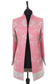 Womens soft curved collar longline jacket in a light pink cashmere fabric with a Tree of Life pattern in pale aqua