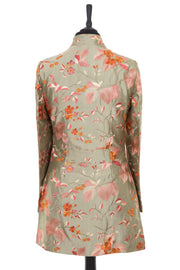 Womens longline jacket with a soft curved collar and slit pockets in a pearlesque soft pale green embroidered silk with soft pink, coral and burnt orange embroidery