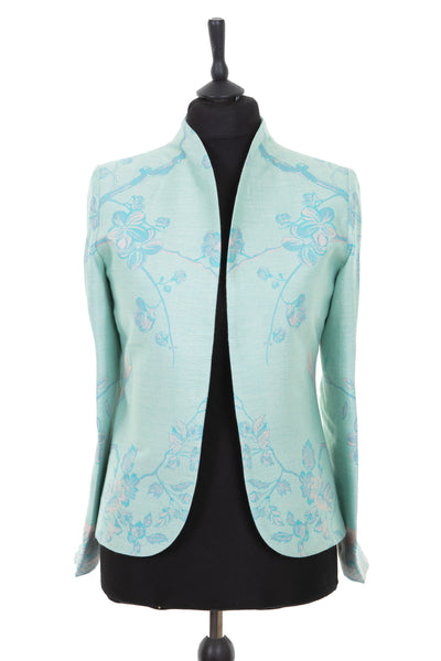 Womens short dress jacket in Eau de Nil pale aqua green cashmere fabric with a Tree of Life pattern in light turquoise