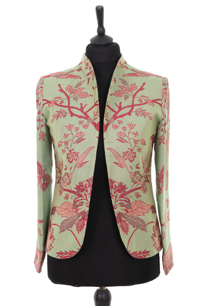 Womens short dress jacket in a light green cashmere fabric with a pink floral pattern