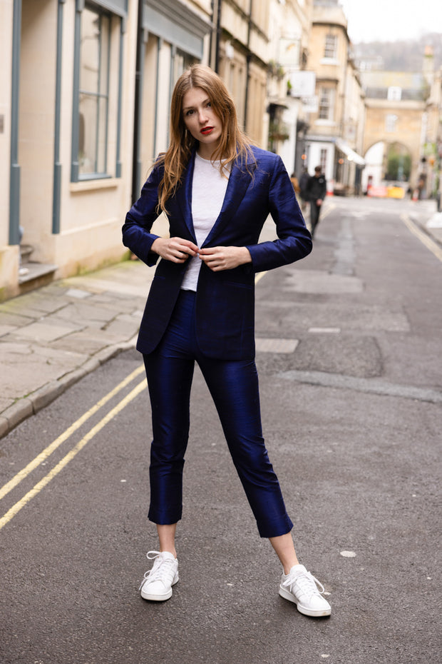 raw silk blue suit for women worn casually with white t-shirt and trainers. 