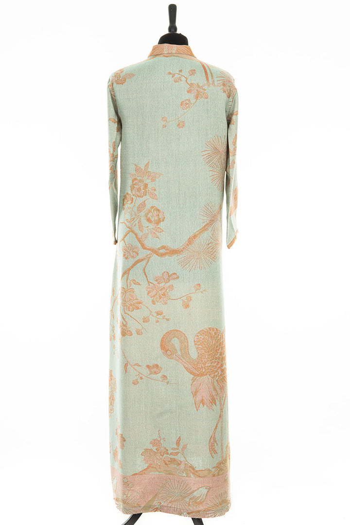 Plus size fashion. Relaxed glamour dress. Long kaftan with orange flowers and birds pattern. 