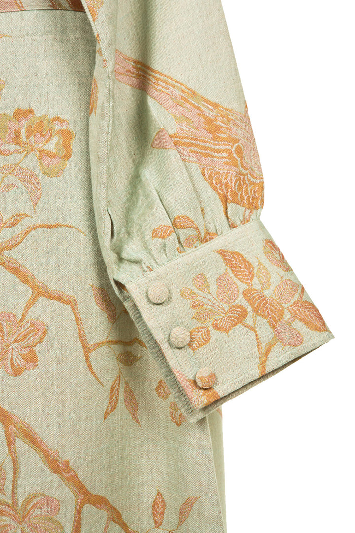 detail of a buttened sleeve edge