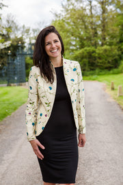 lady wearing a light jacket with black dress