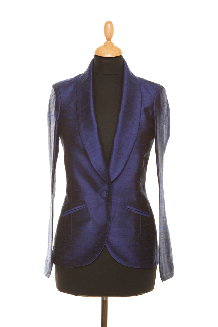 Blue silk women's jacket that is fitted with one button. 