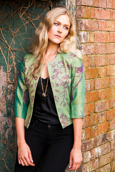 short Chanel style jacket in green fabric with beautiful pattern