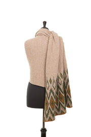 Scarf wrapped around mannequin in beige, green and yellow. 